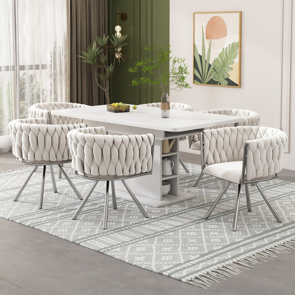 Dining room with a white table and chairs on a patterned rug.
