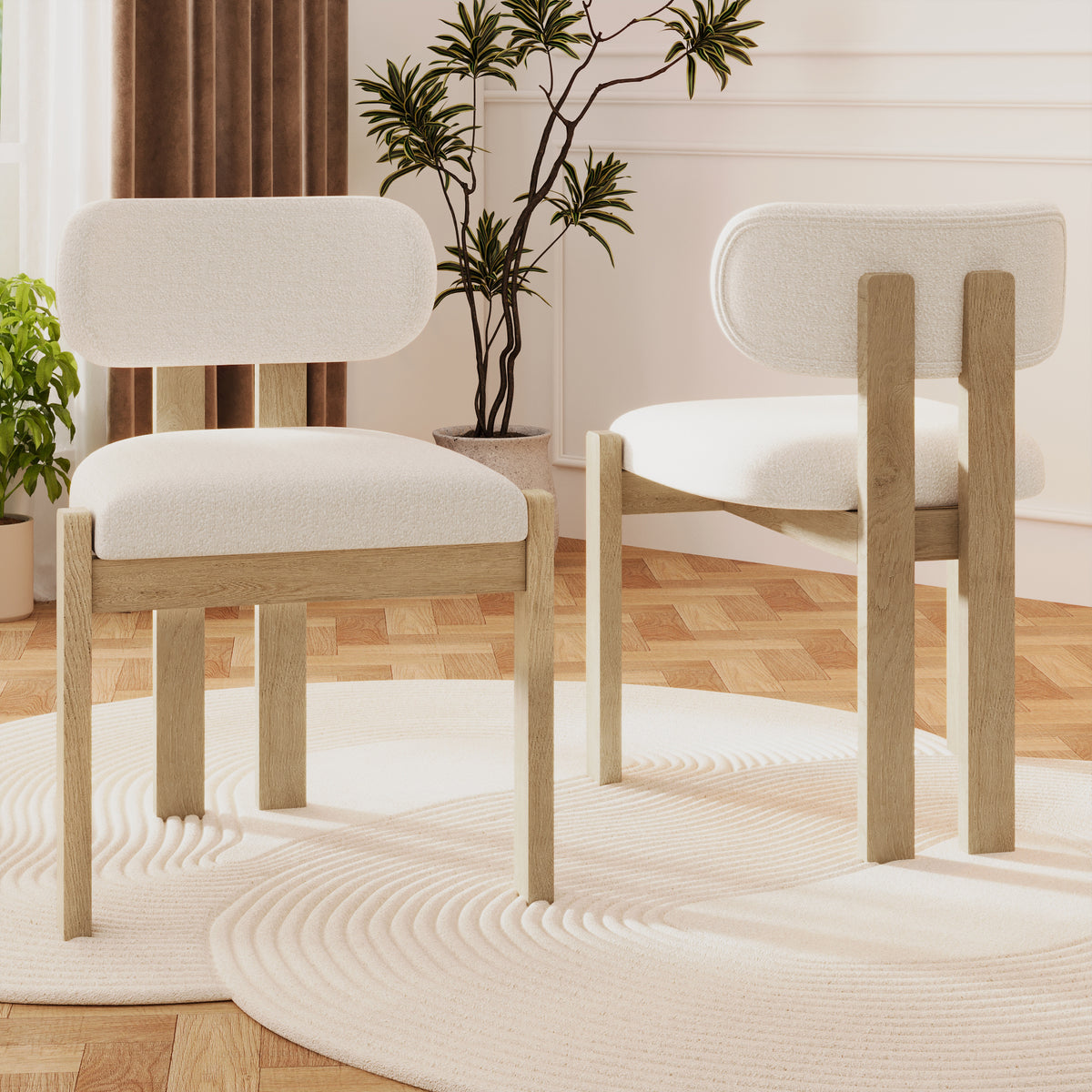 Two wooden chairs with white cushions in a room with plants and a rug.