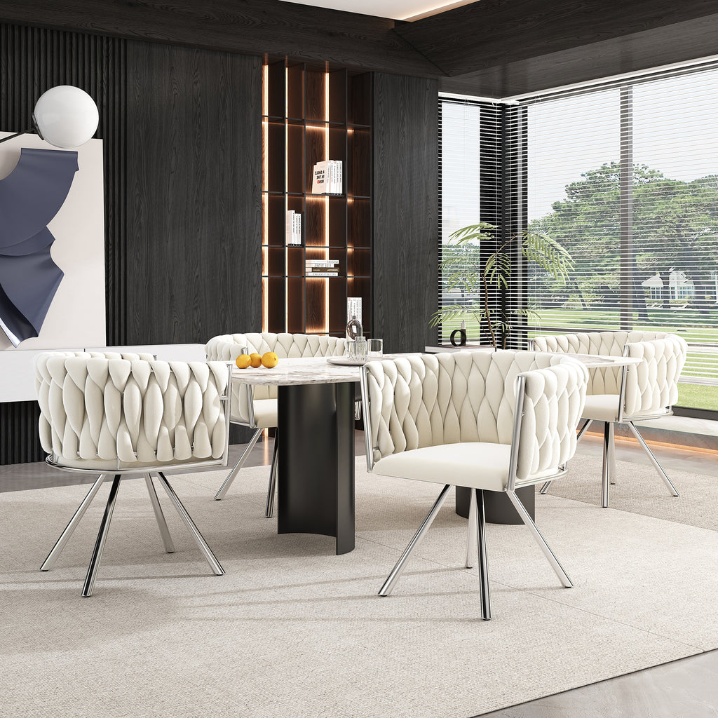 Modern dining room with white chairs and a black table.