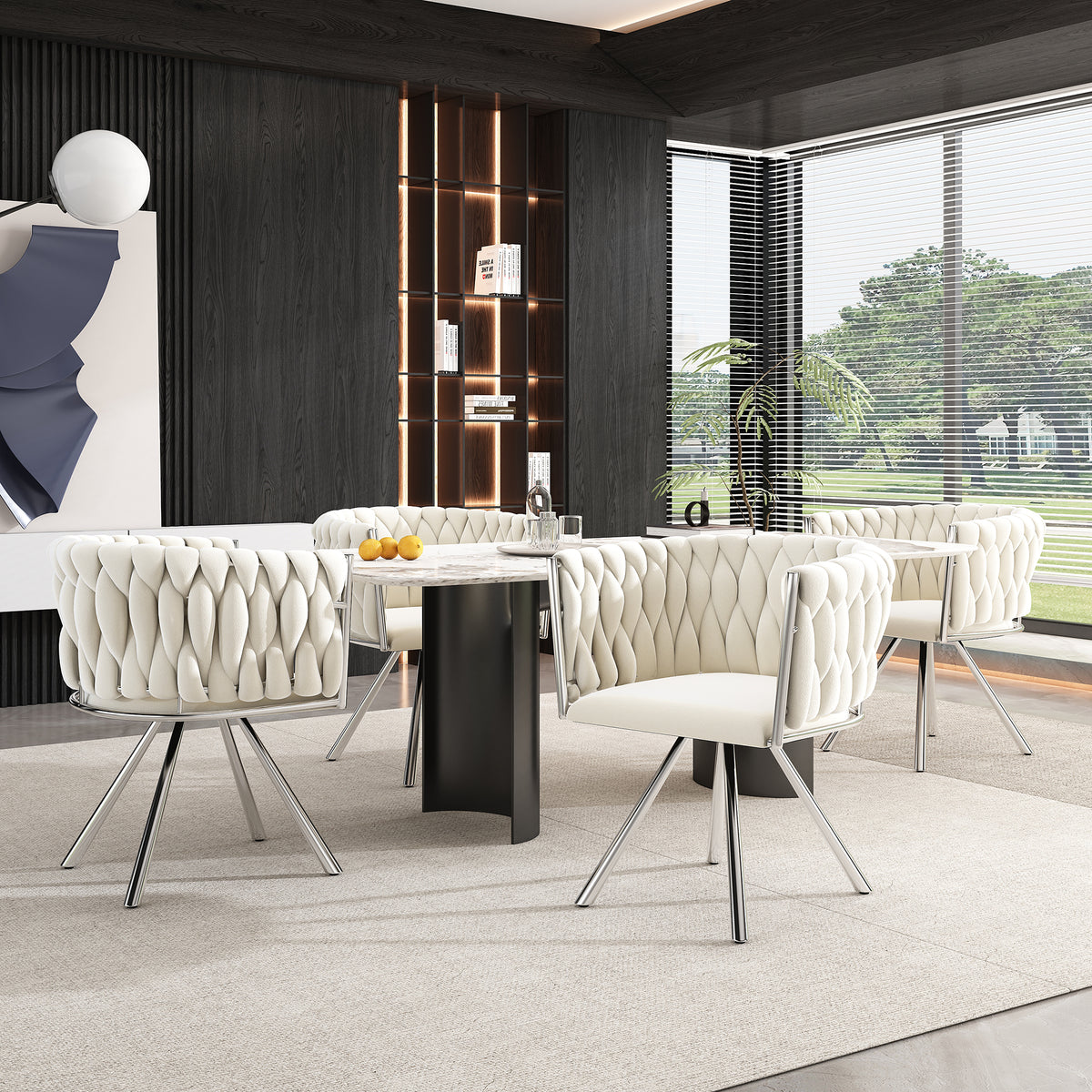 Modern dining room with white chairs and a black table.