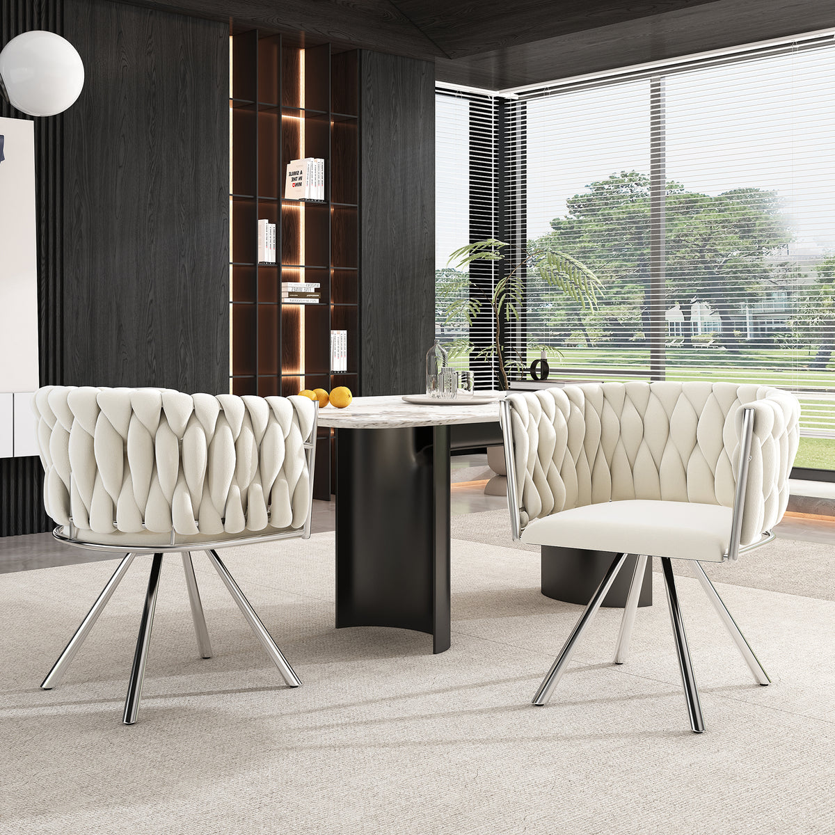 Modern office setup with two tufted chairs and a desk in a bright room.