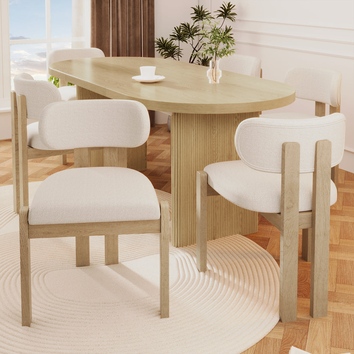 Dining room with wooden table and chairs on a wooden floor.