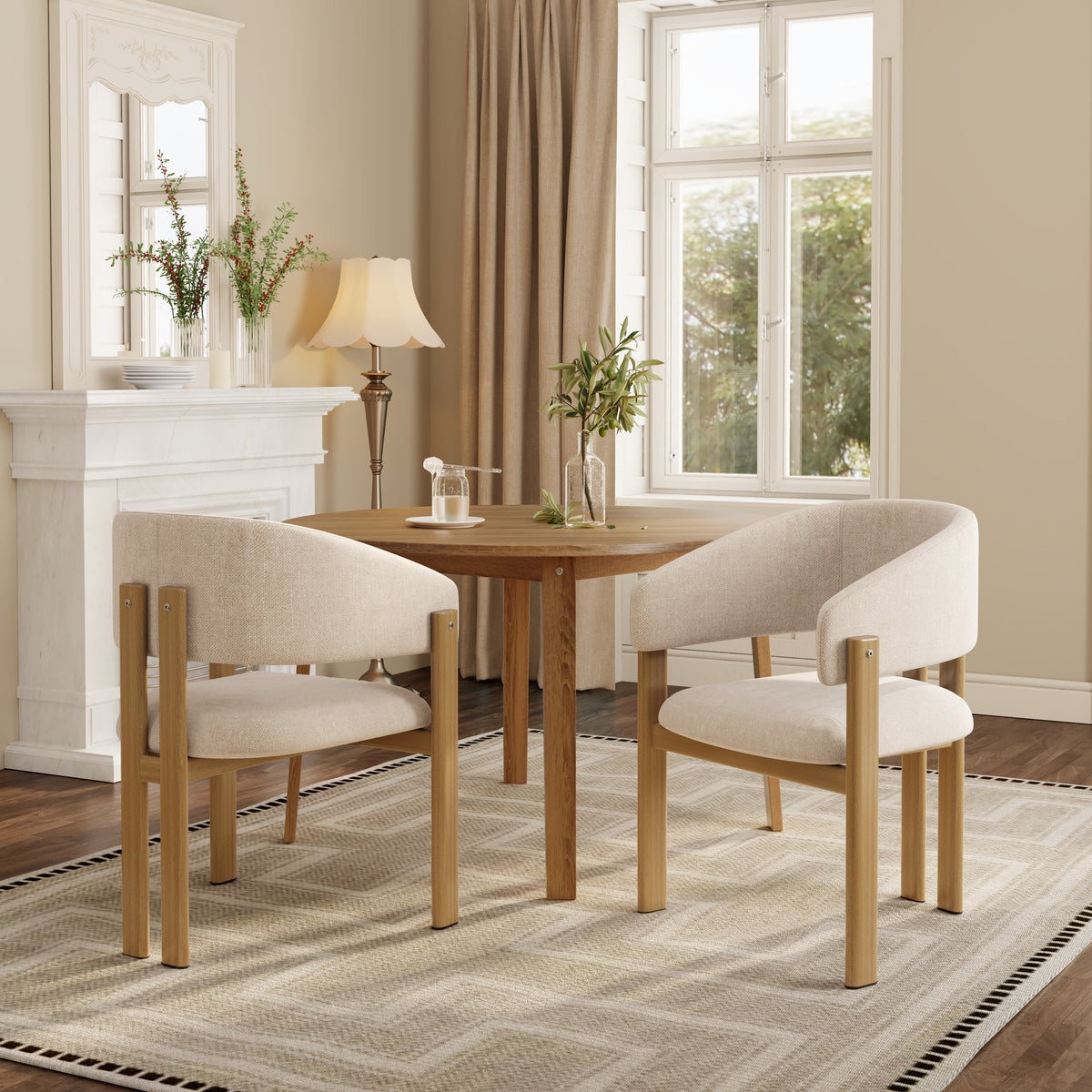 A 4-piece dining set featuring a round wooden table and two modern curved-back armchairs with beige upholstered seats and light wood frames, styled in a bright, contemporary dining room.