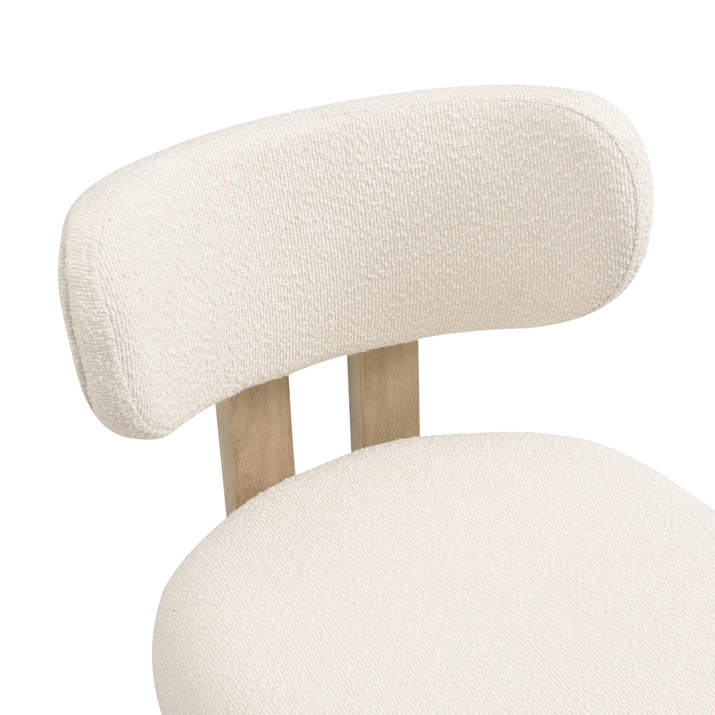 Close-up of a modern chair with curved design and light wood legs on a white background